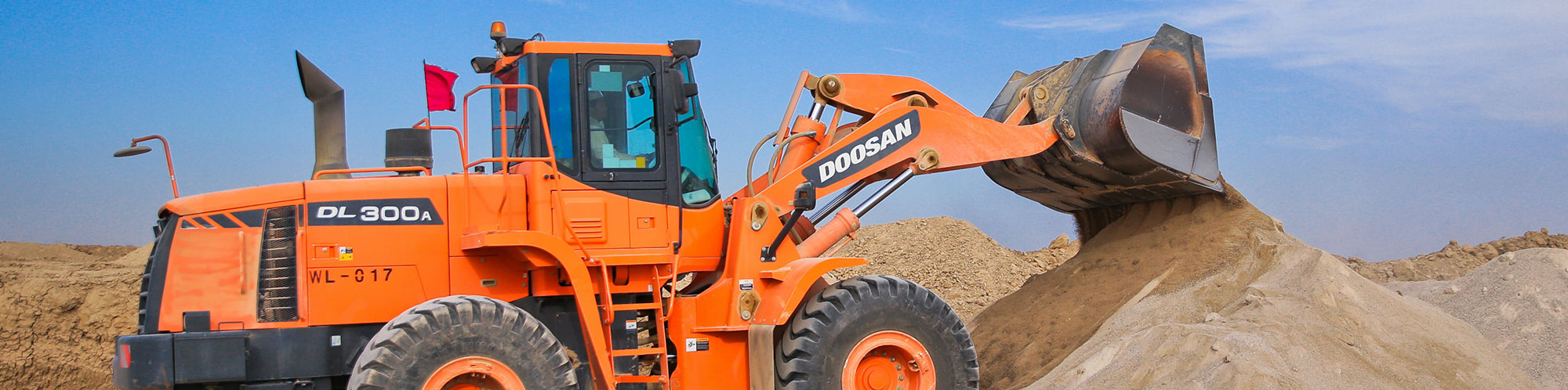 An image of an orange bulldozer in action